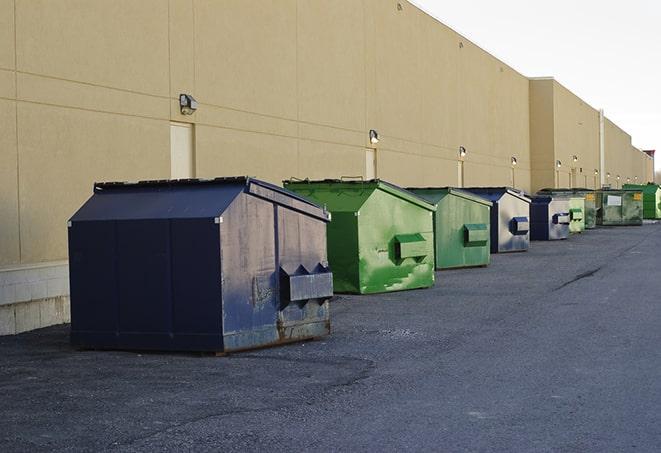 large garbage containers clustered on a construction lot in Canton